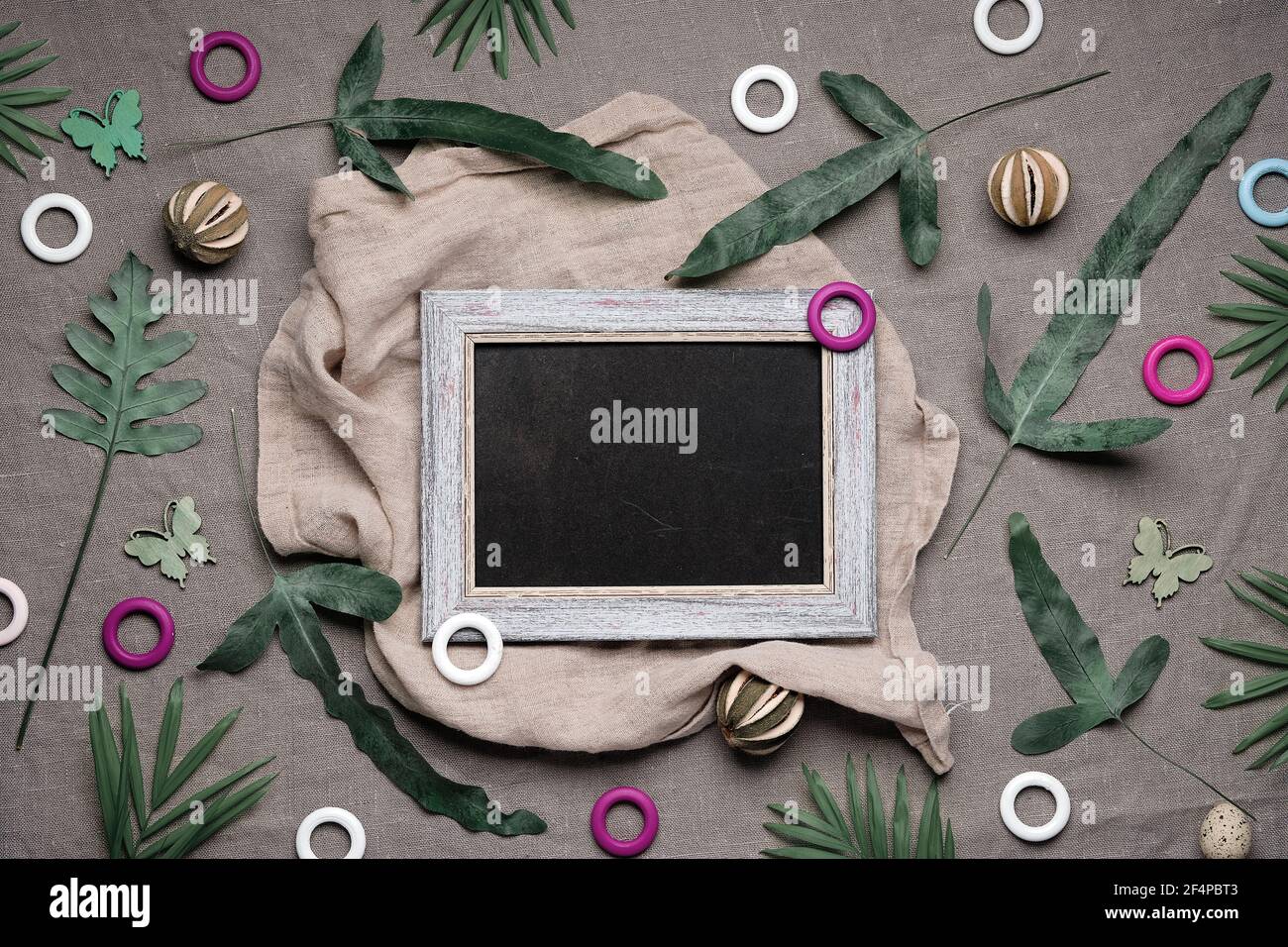 Jungle floral flat lay on earthcolored natural linen textile