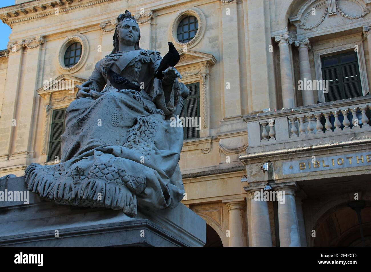 statue of queen victoria and national library in valletta in malta