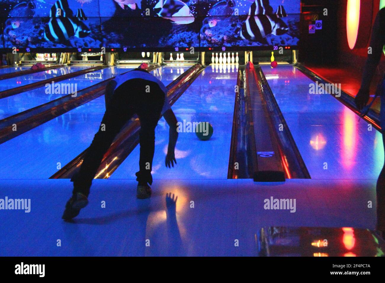 Playing bowling with friends Stock Photo