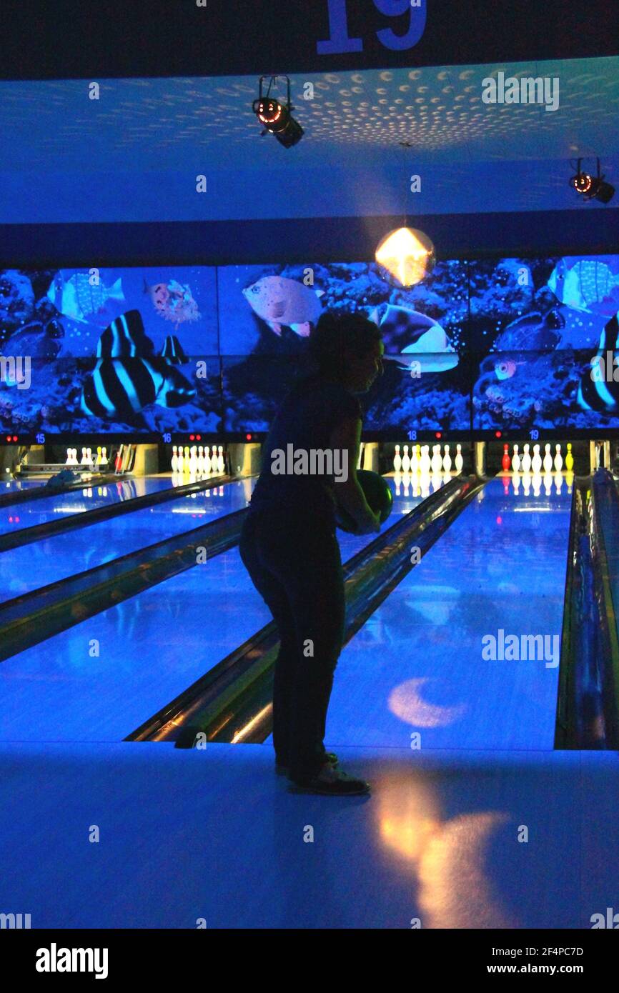 Playing bowling with friends Stock Photo