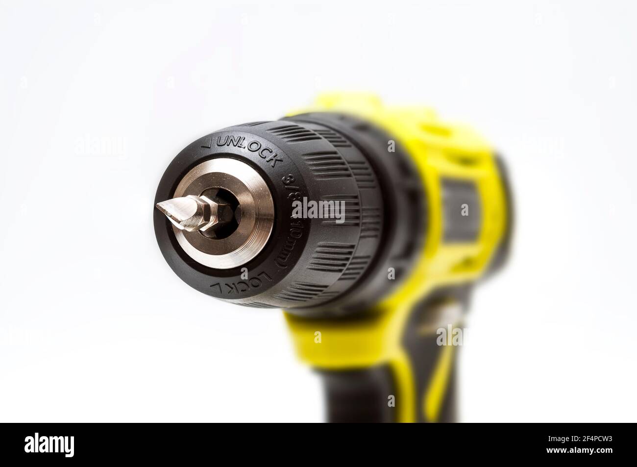 Ryobi 3/8 cordless electric drill showing a closeup of 3-jawed chuck with  a Phillips screw driver bit inserted Stock Photo - Alamy