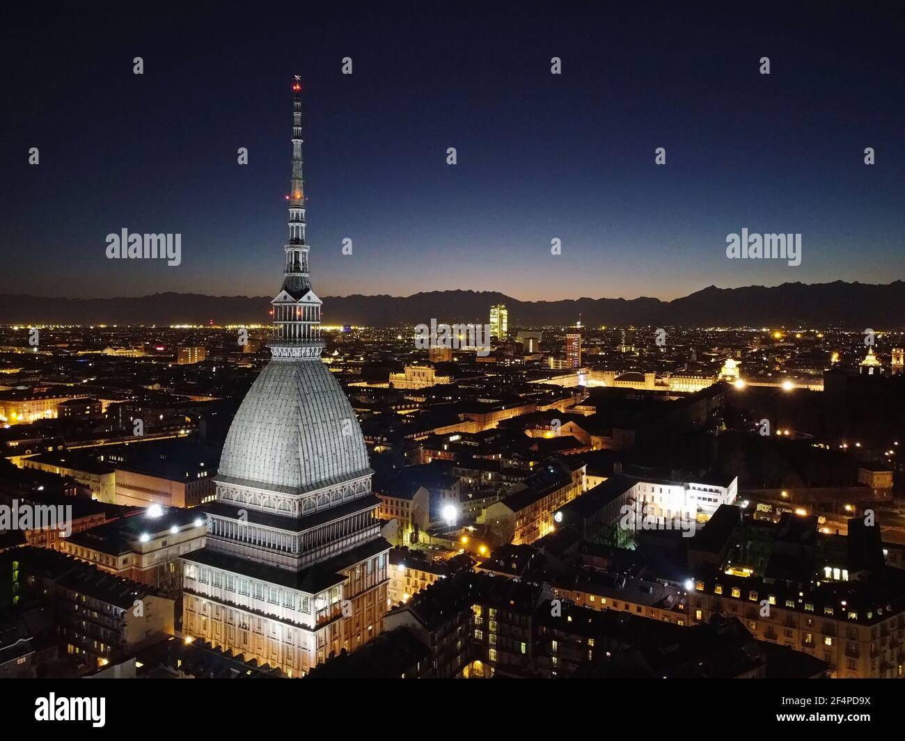 Night view of the illuminated Mole Antonelliana. Turin, Italy - March 2021 Stock Photo