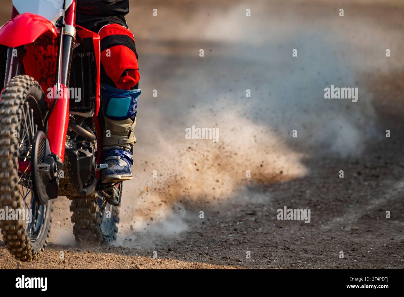 https://c8.alamy.com/comp/2F4PDTJ/close-up-of-man-riding-his-off-road-motorcycle-on-dirt-race-course-2F4PDTJ.jpg
