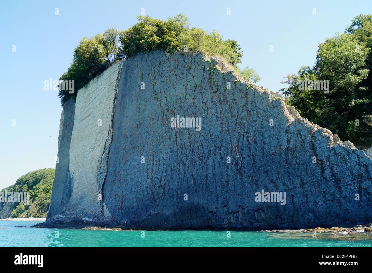 View from the sea on the vertical Kiselev rock in the Black Sea Stock Photo