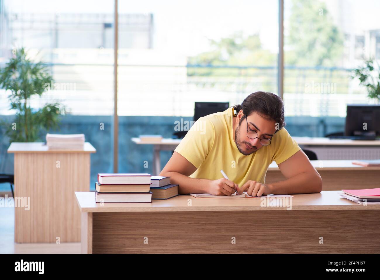Getting Ready For Testing Young student preparing for exams in the classroom Stock Photo - Alamy