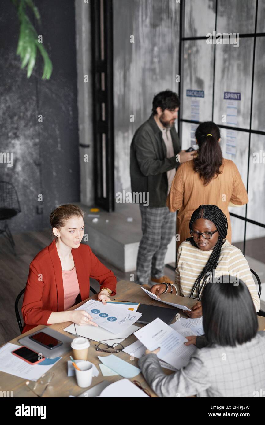 High angle view at diverse group of business people working in office Stock Photo
