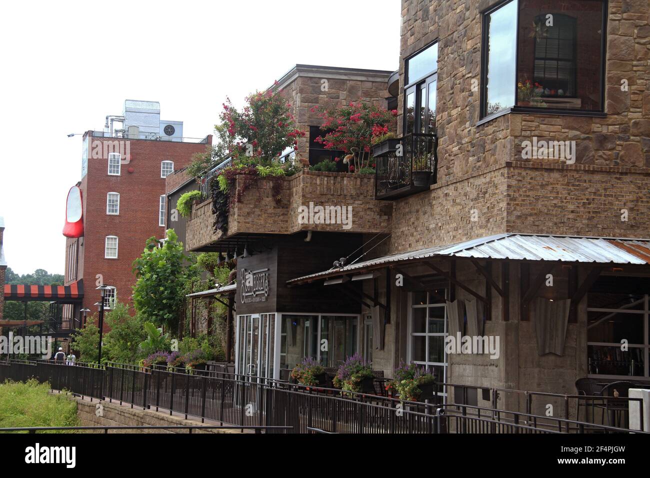 Buildings along the Bluffwalk in downtown Lynchburg, VA, USA. The restaurant Bootleggers & Craddock Terry Hotel. Stock Photo