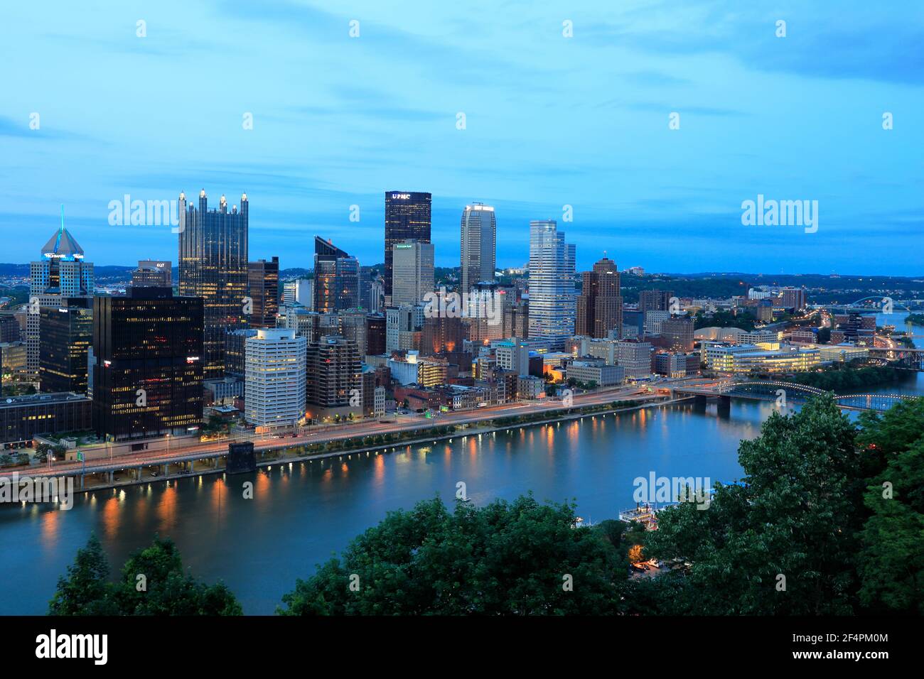 Downtown Pittsburgh and Central Business District with Monongahela River in foreground during dusk.Pittsburgh.Pennsylvania.USA Stock Photo