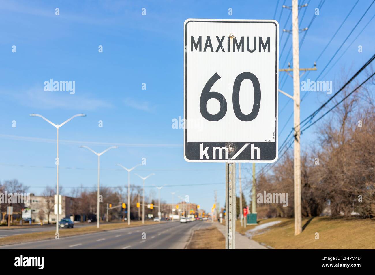 Ottawa, Canada - March 19, 2021: Speed limit road sign, 60 km h maximum Stock Photo