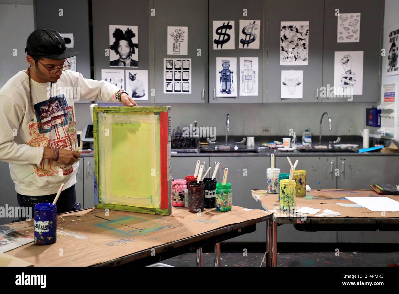 A young man making Silkscreen prints in workshop for children in Andy Warhol Museum.Pittsburgh.Pennsylvania.USA Stock Photo
