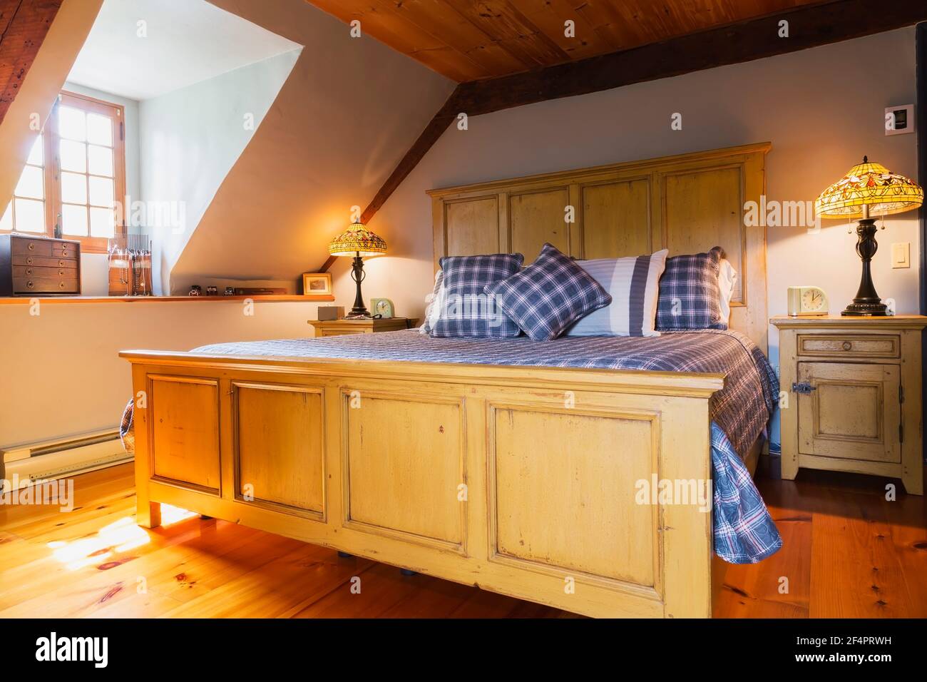 King size bed with buttermilk pine wood headboard and footboard, blue