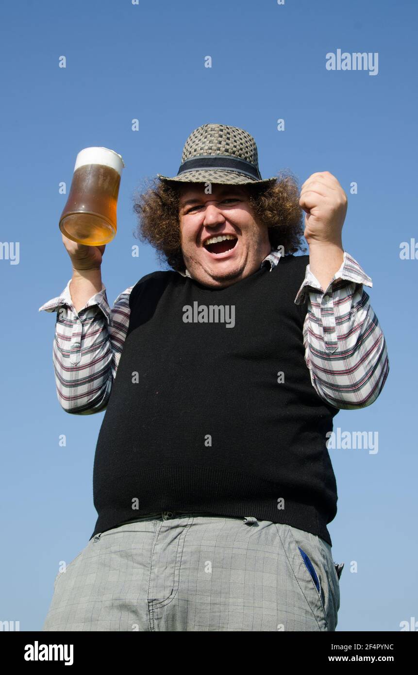 Funny fat guy is drinking beer Stock Photo Alamy