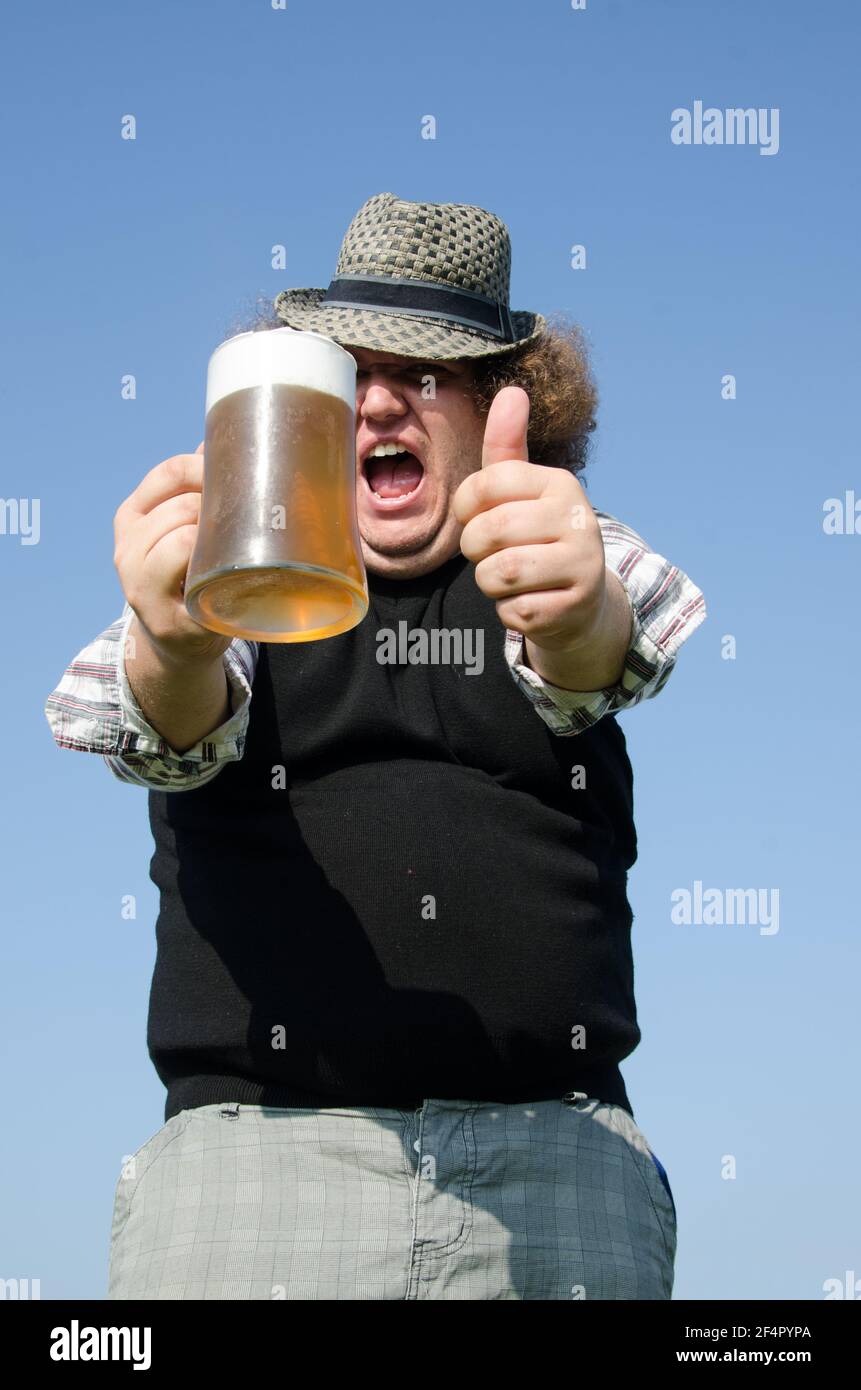 Funny fat guy is drinking beer Stock Photo - Alamy Funny fat guy is drinking beer Stock Photo - Alamy
