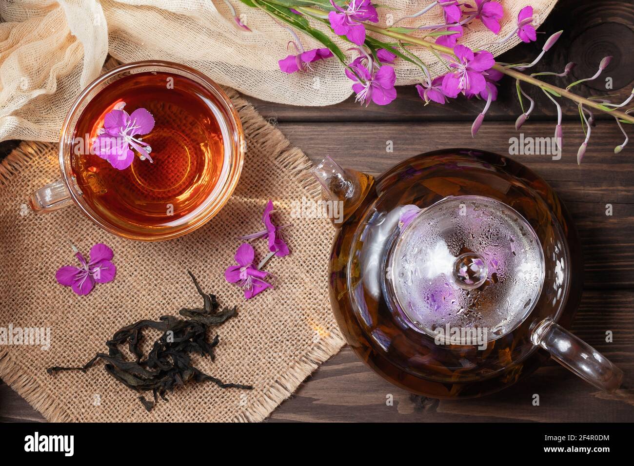 Herbal tea made from fireweed known as blooming sally in teapot and cup, top view. Stock Photo