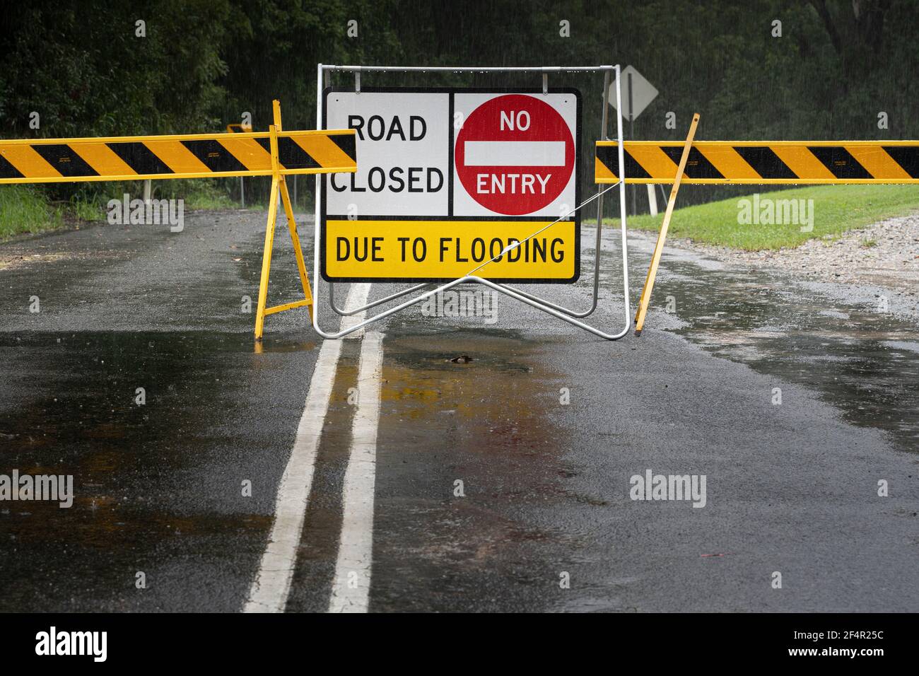 Sign warning of the road ahead being closed due to flooding Stock Photo ...