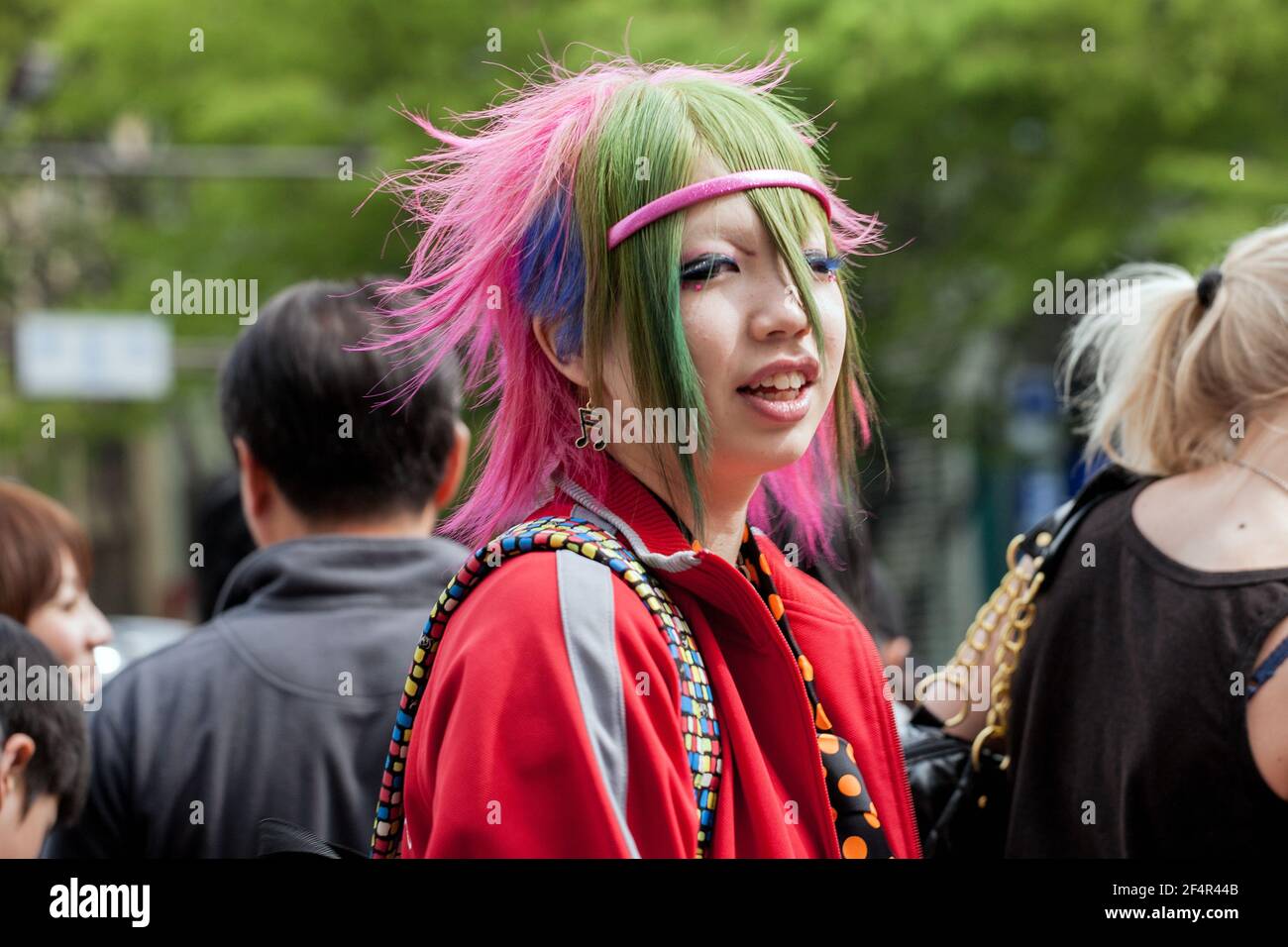 Street Fashion 2008: Japanese female with multicoloured dyed hair and colourful clothes, Harajuku, Tokyo, Japan Stock Photo