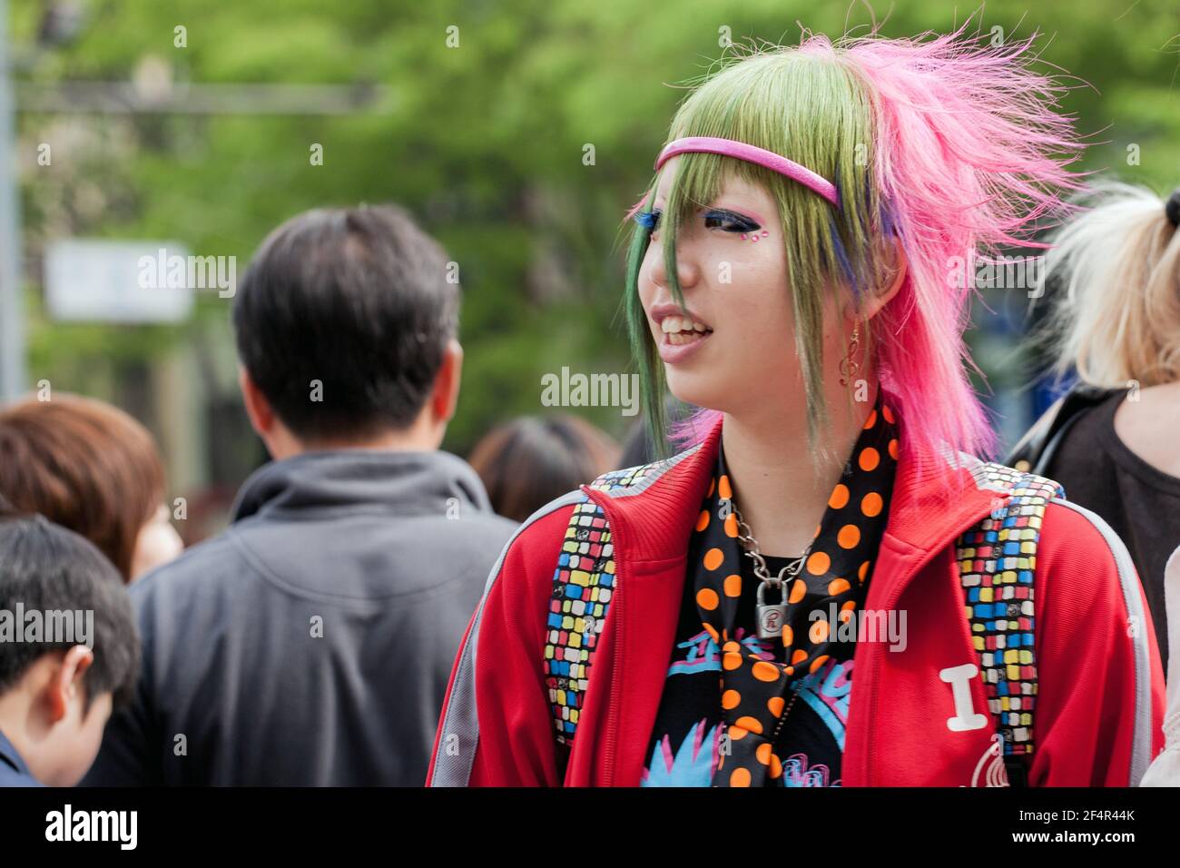 Street Fashion 2008: Japanese female with multicoloured dyed hair and colourful clothes, Harajuku, Tokyo, Japan Stock Photo