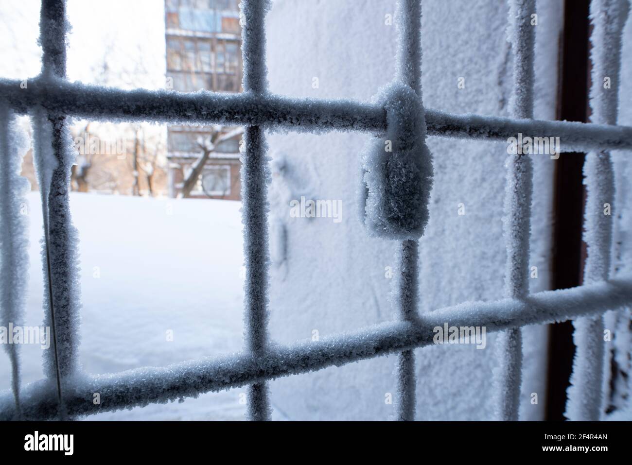 door handle and keyhole are covered with frost - freezes icy with snowflakes Stock Photo