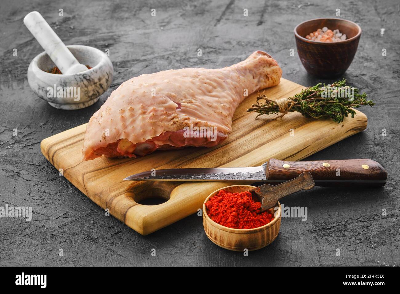 Raw fresh turkey drumstick with spices Stock Photo