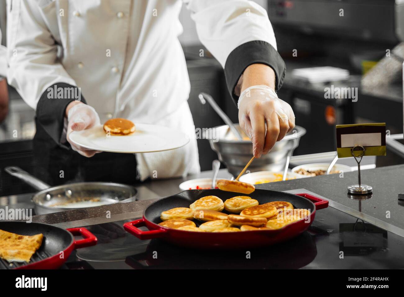 Restaurant chef cooking pancakes in the kitchen Stock Photo Alamy