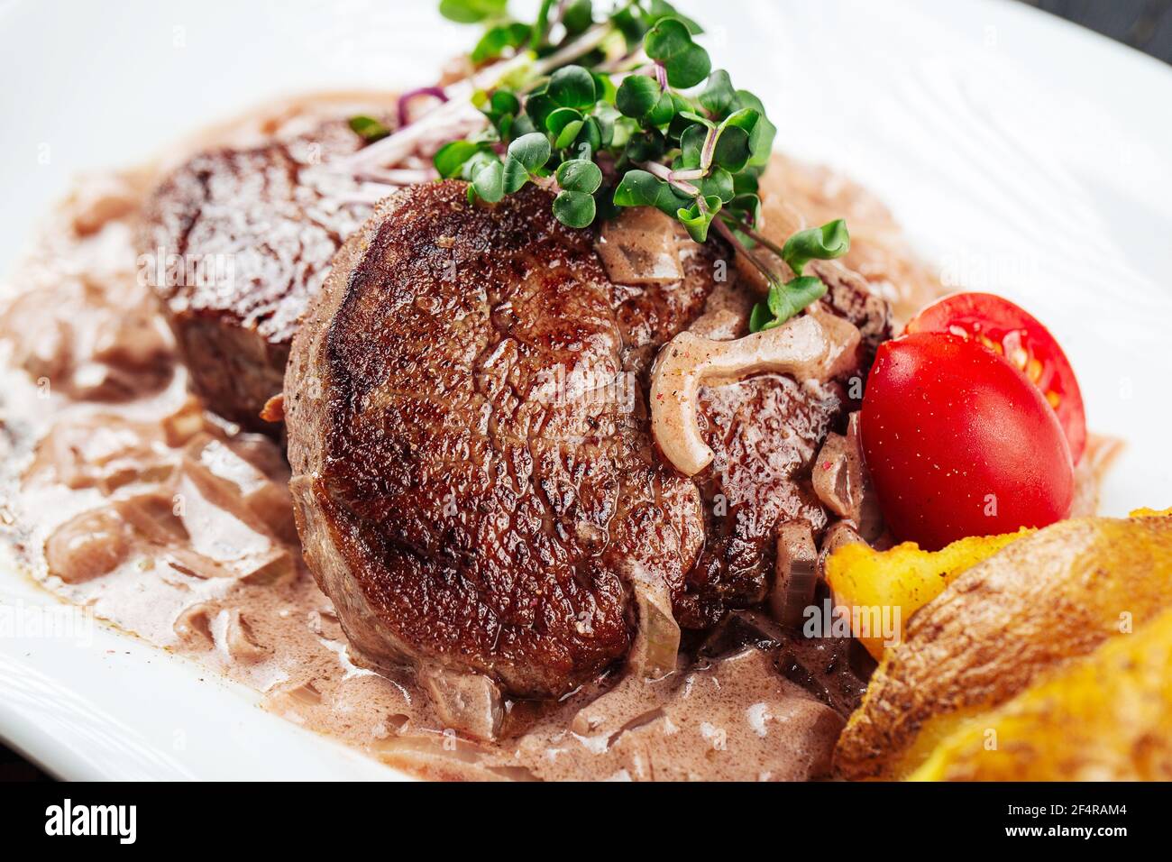 Fillet mignon steaks mushroom sauce with potatoes Stock Photo