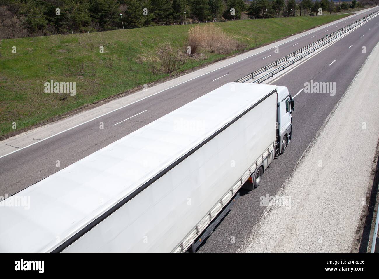 Moving truck with high speed on the countryside highway in a bright day Stock Photo