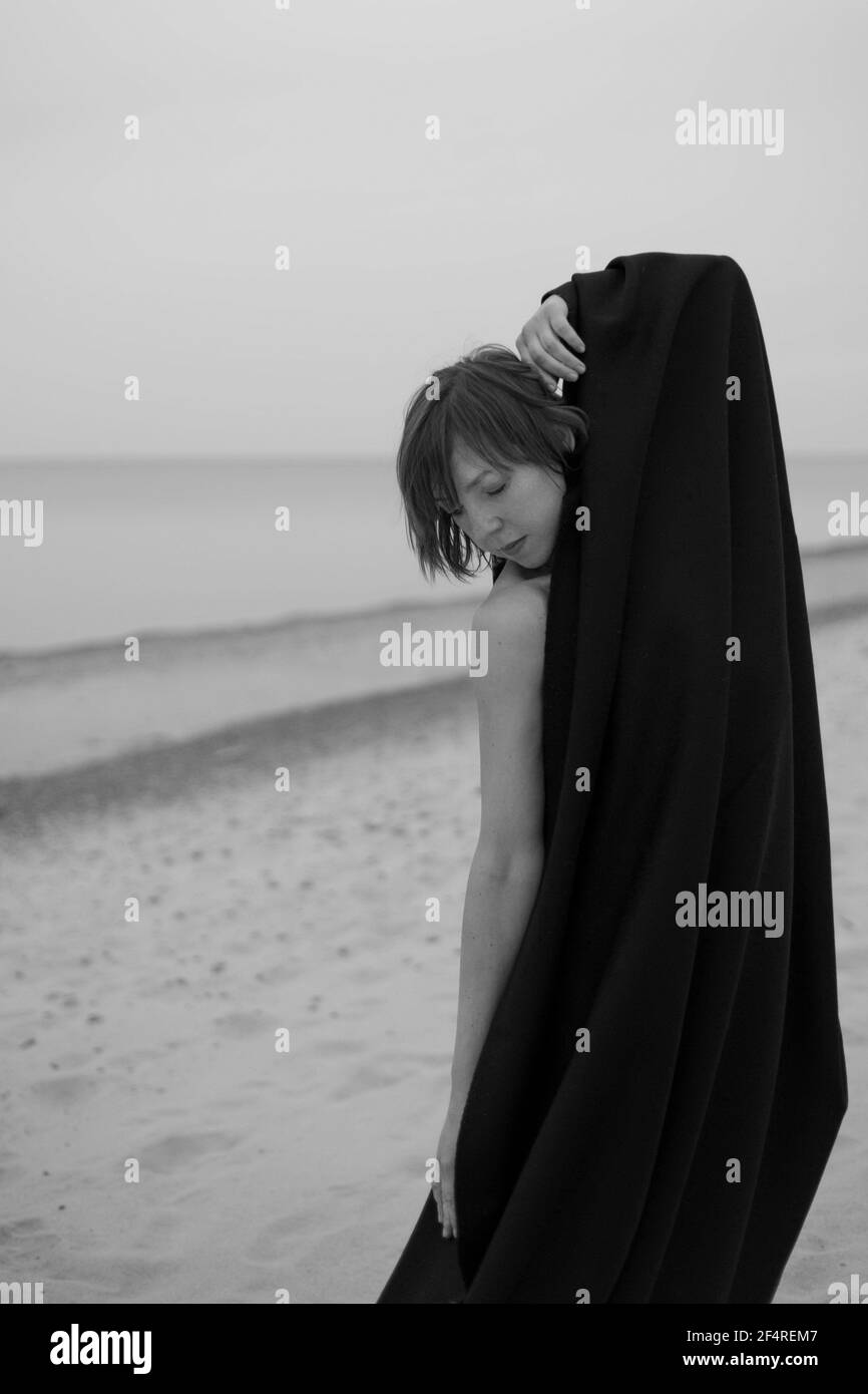 Woman walking wrapped Black and White Stock Photos & Images - Alamy