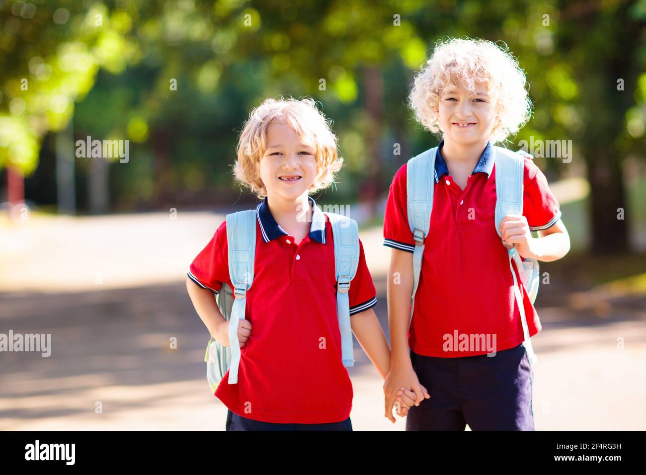 Children go back to school. Start of new school year after summer vacation. Boy and girl with