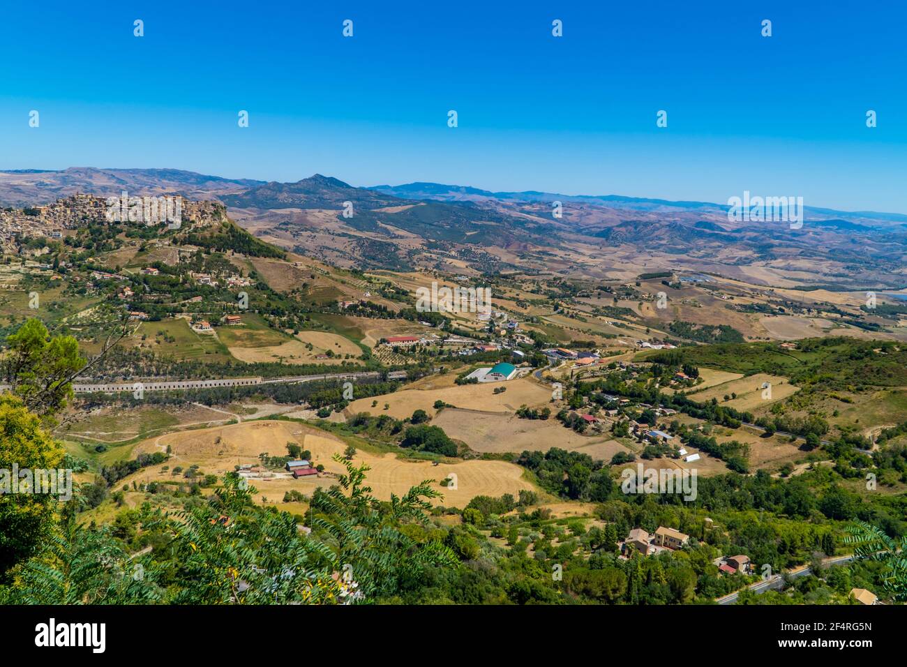The landscapes of central Sicily, Italy with villages and the town of Leonforte on the hill Stock Photo