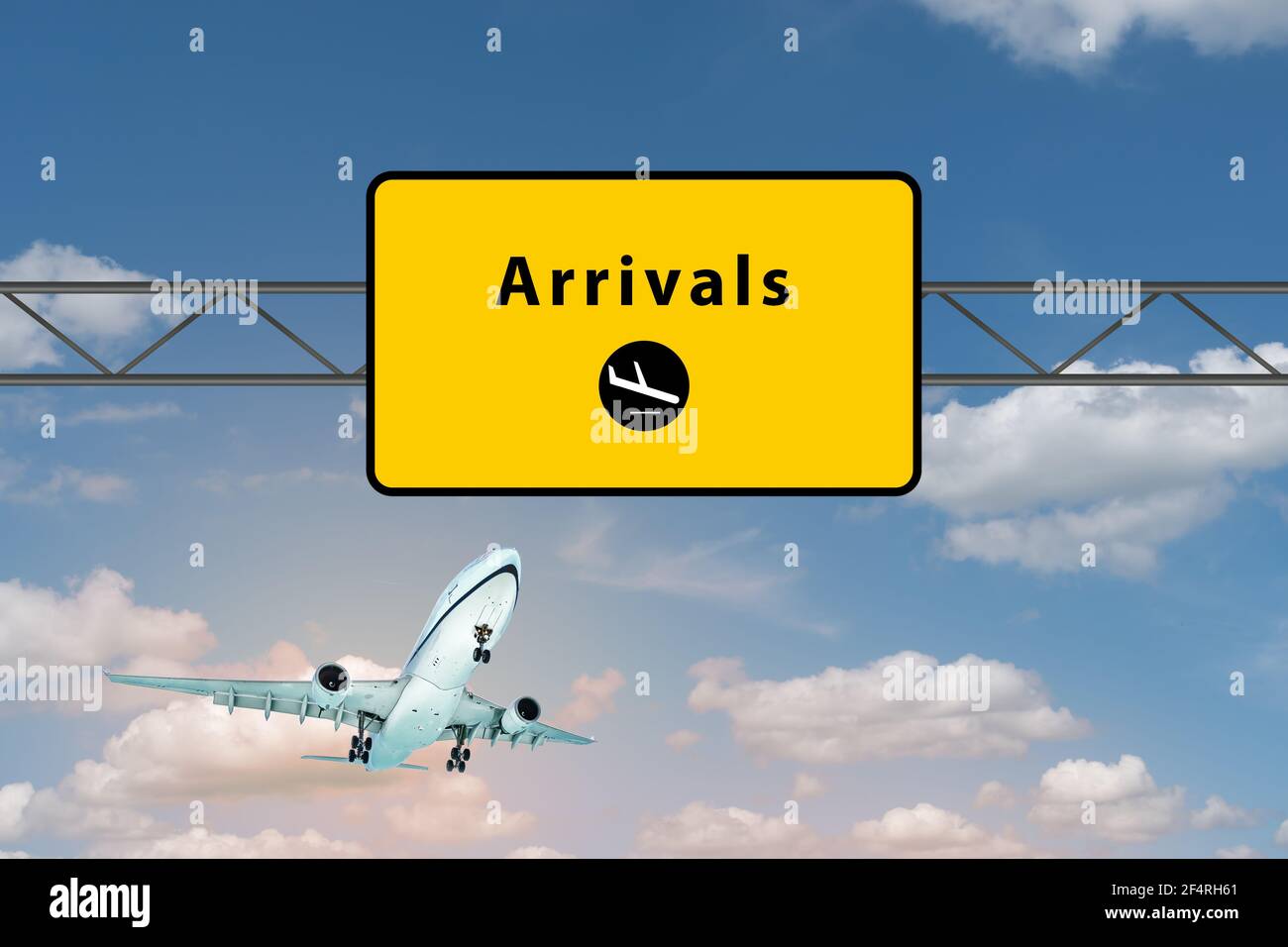 Arrivals airport sign above highway. Landing airplane in the sky. Stock Photo