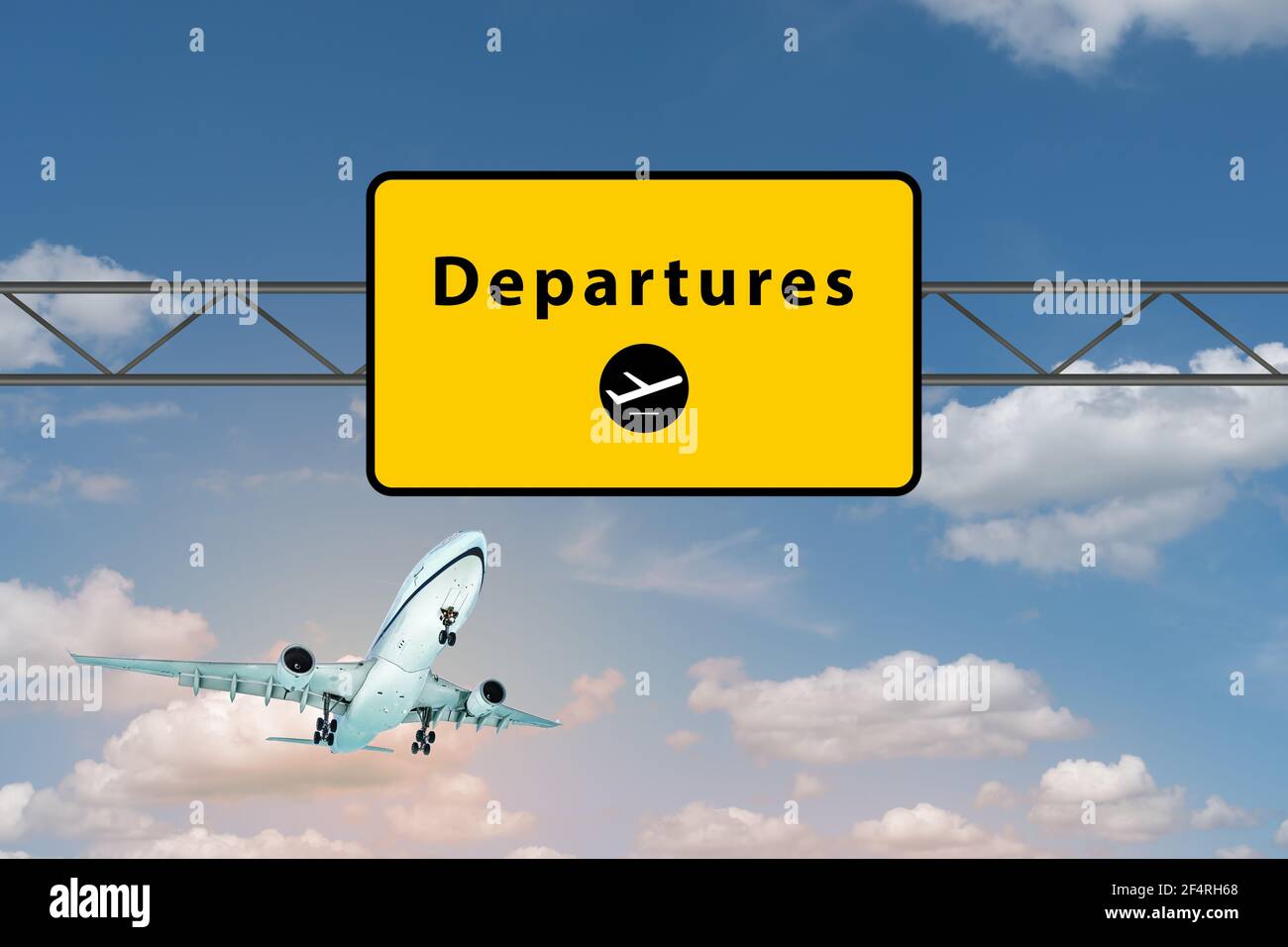 Departures airport sign above highway. Landing airplane in the sky. Stock Photo