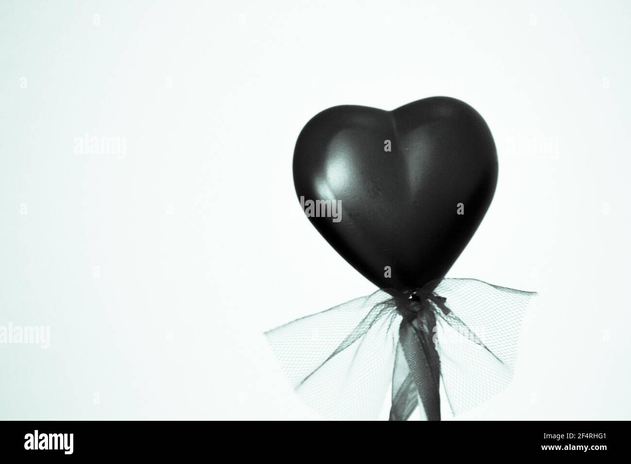 Shiny red heart on rainbow background. Copy space Stock Photo - Alamy