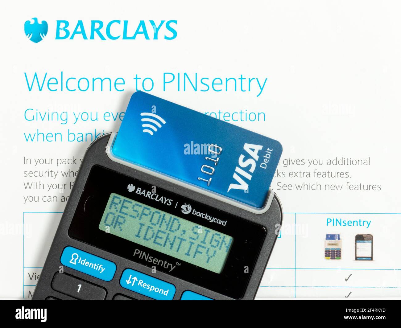 Barclays Pinsentry card reader device with Visa Debit card and welcome to PINsentry letter close up. Stock Photo