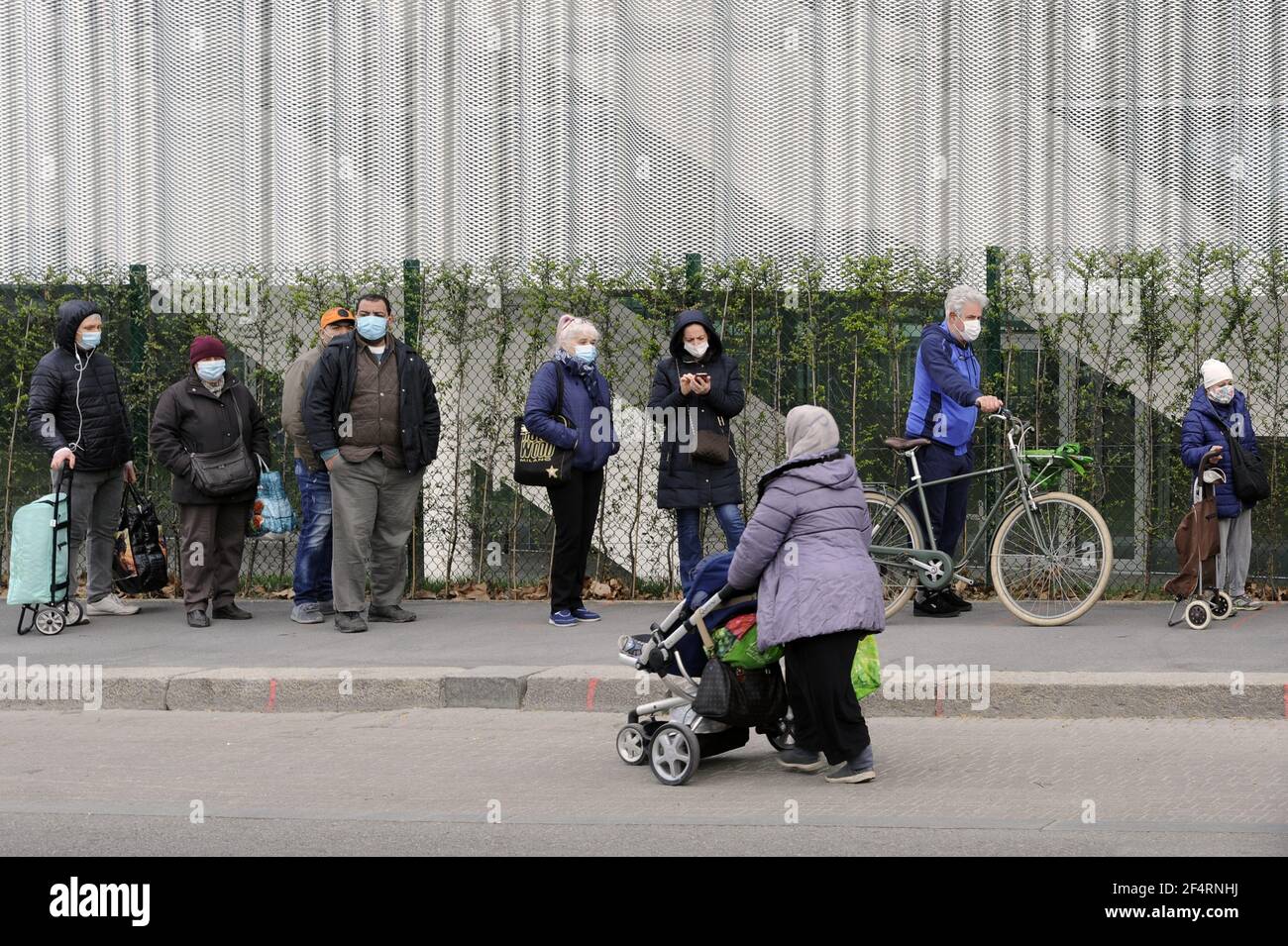 Milan (Italy), the non-profit organisation Pane Quotidiano (Daily Bread) distributes essential foodstuffs to people in economic difficulty due to the crisis caused by the Coronavirus epidemic. More and more social groups are affected, and every day the queue gets longer. Stock Photo