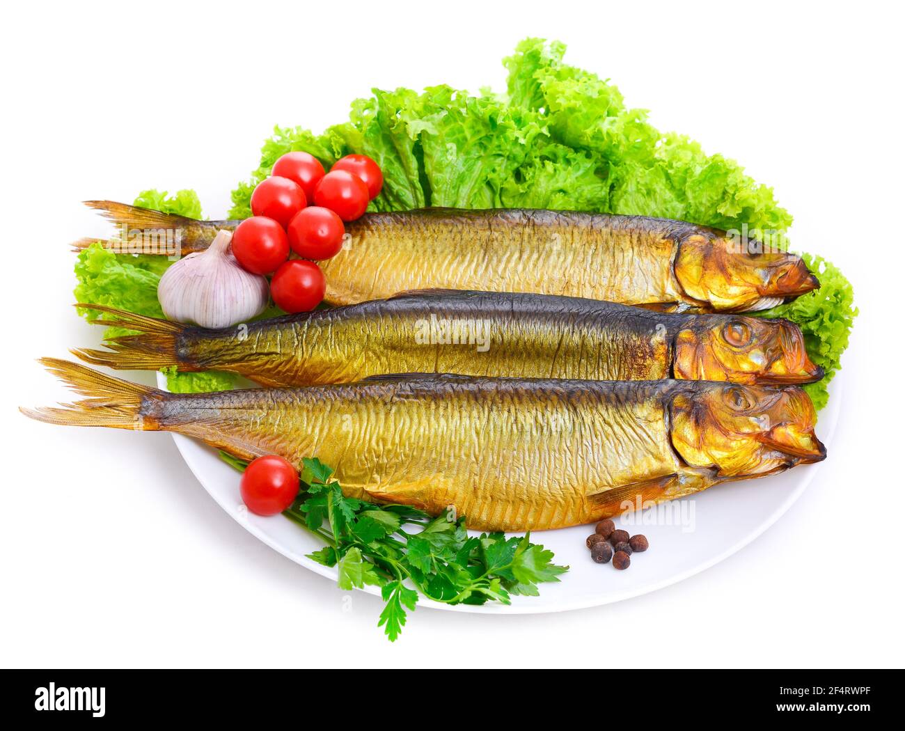 Appetizing smoked fish on a platter Stock Photo