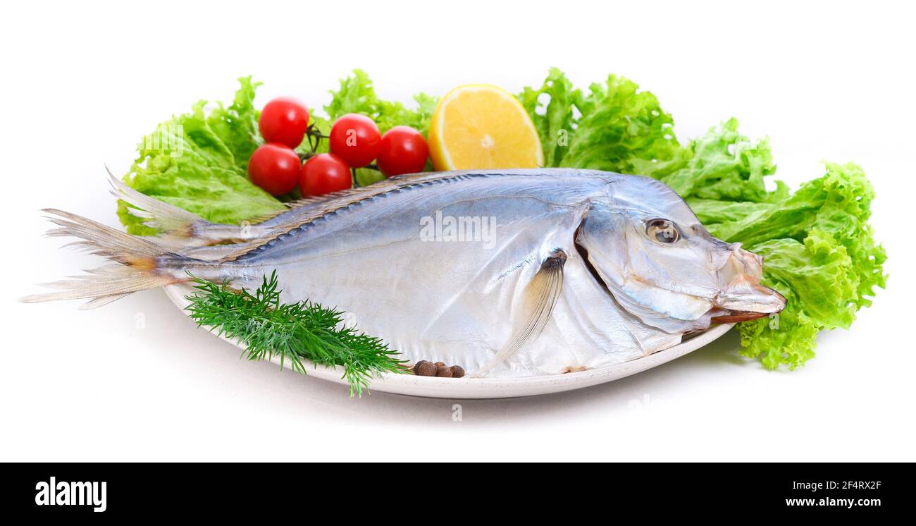 Vomer setapinnis (selene pisces) Group of dried fish at plate . Seafood Stock Photo