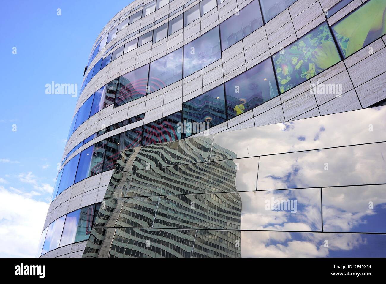 Detail of modern buildings at Kö-Bogen, designed by the New York star architect Daniel Libeskind, with reflection of Dreischeibenhaus building. Stock Photo