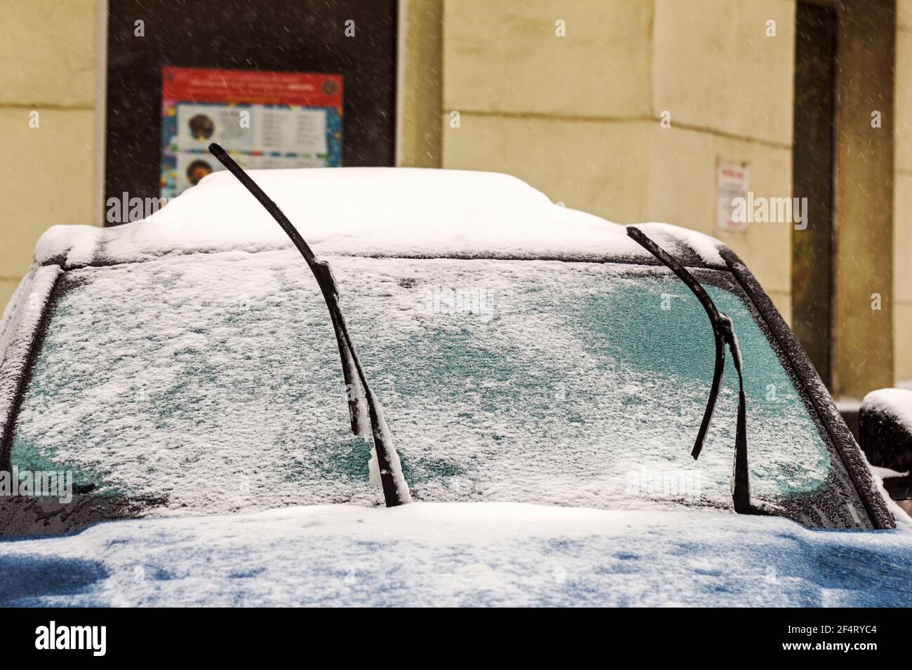 Real raised windshield wipers for cars in snowy winter weather day Stock Photo