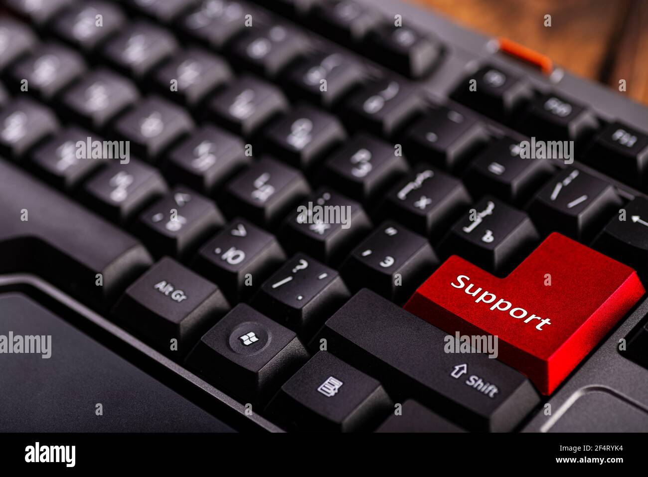 Close-up enter button with inscription support. Computer keyboard close up. Technical support. Stock Photo