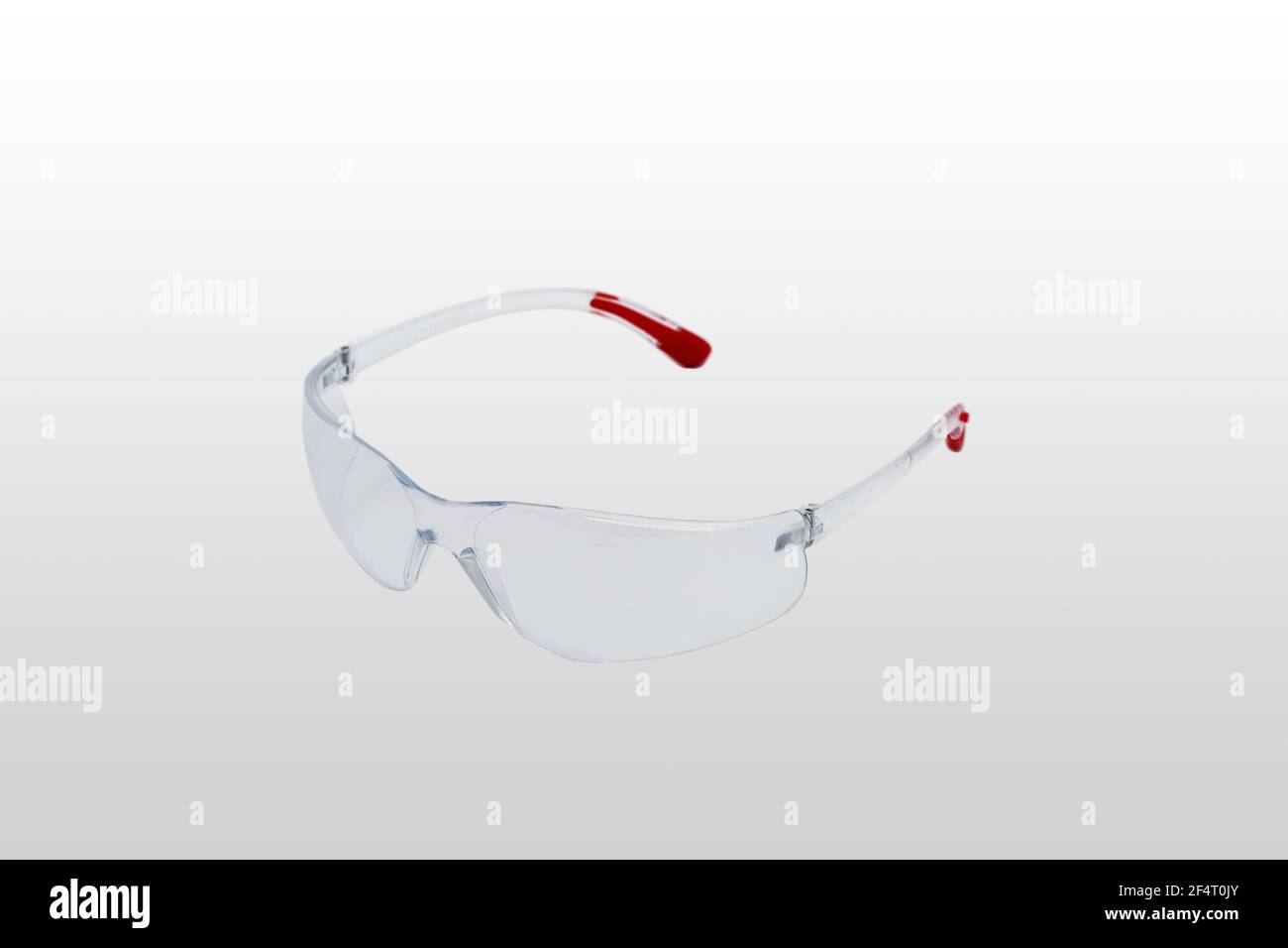 Safety glasses are transparent. Close-up. Isolated on a gray background. Stock Photo