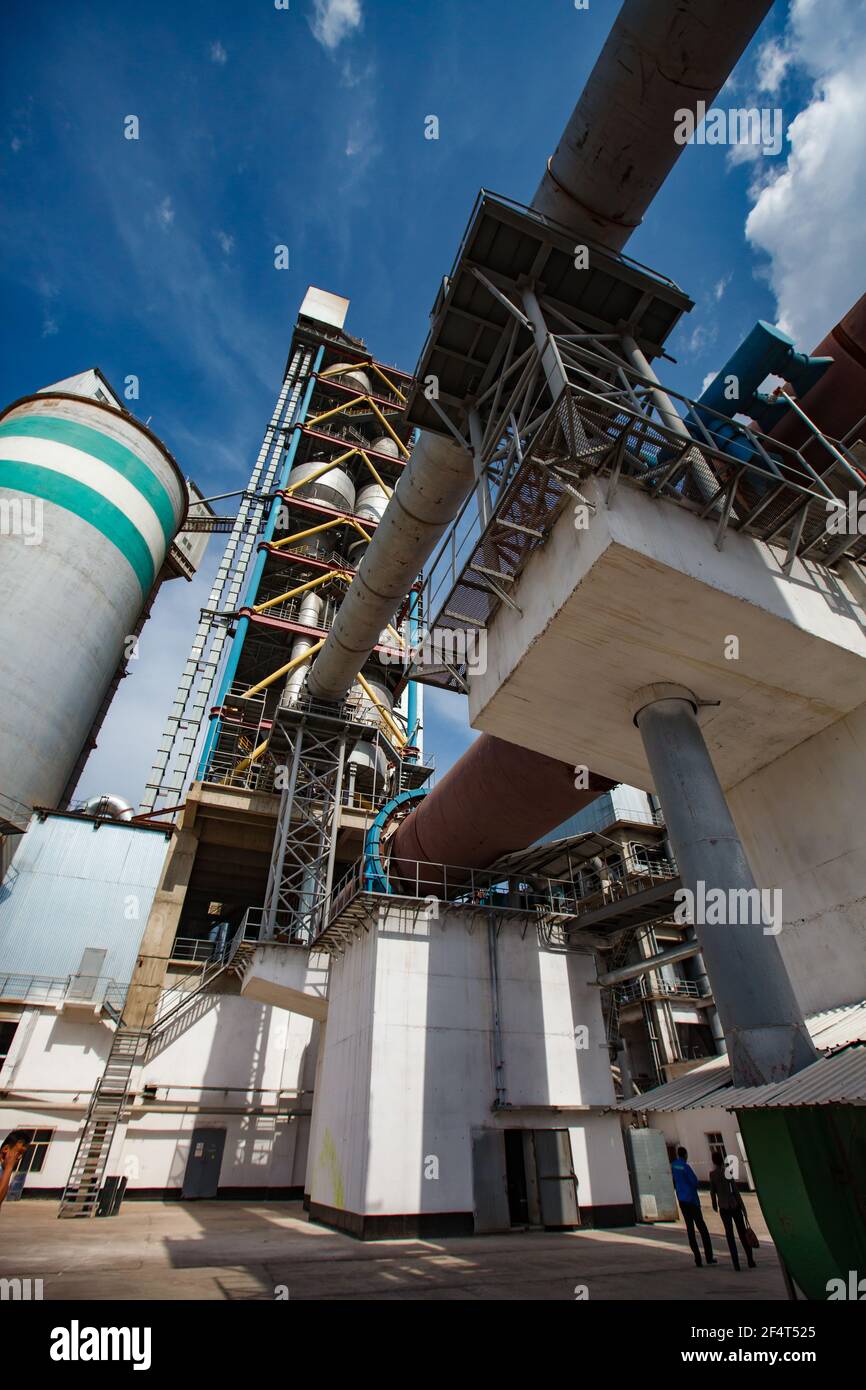 Standard Cement plant. Rotary clinker kiln, concrete silo tower and