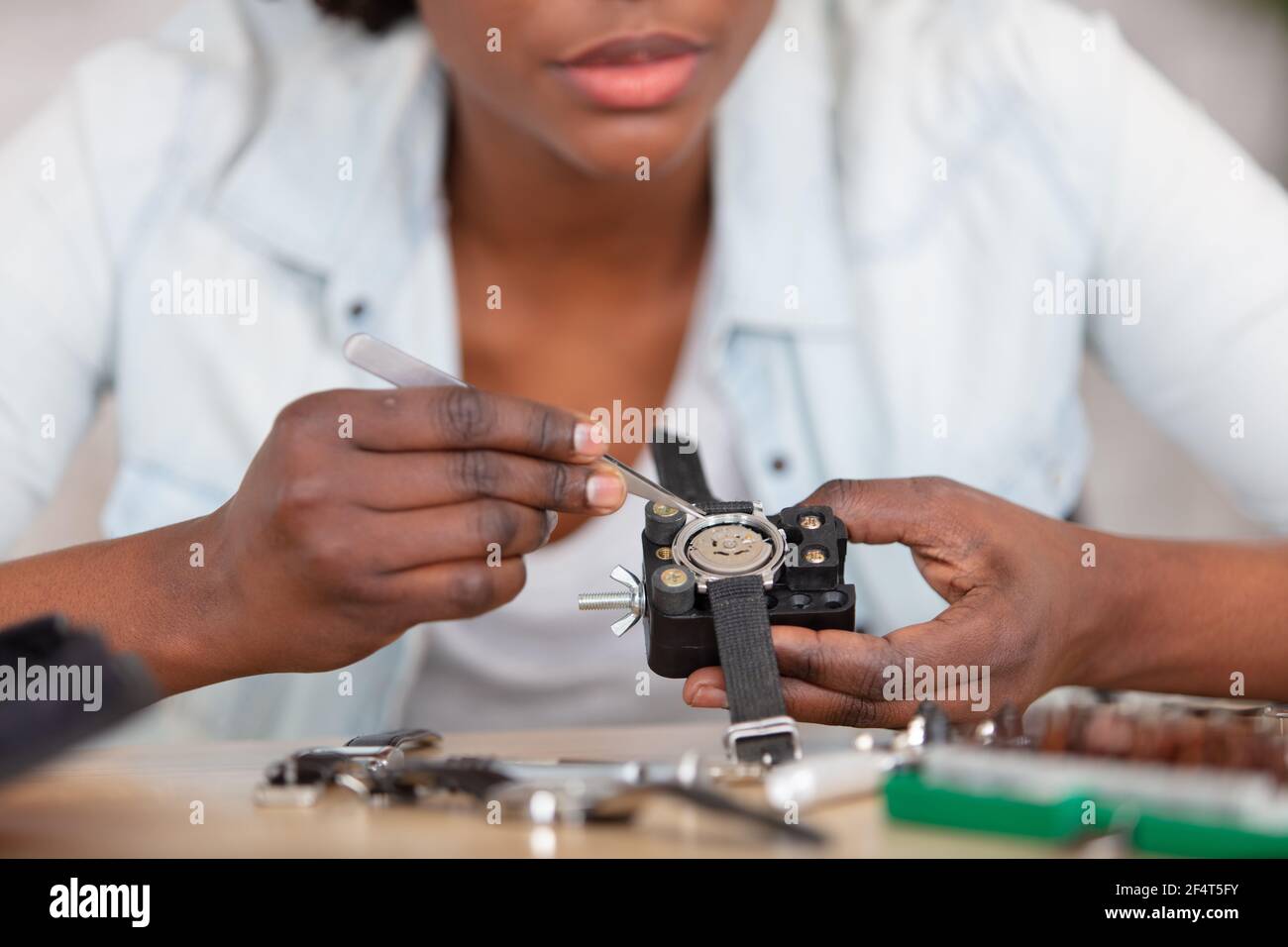 clockmaker repairing wrist watch at workshop Stock Photo - Alamy