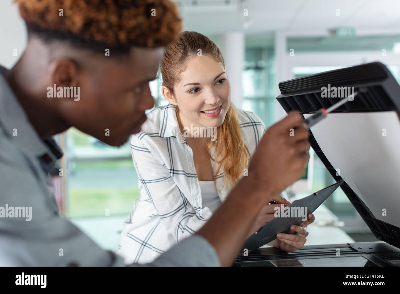 printer and the customer checking the machine Stock Photo - Alamy