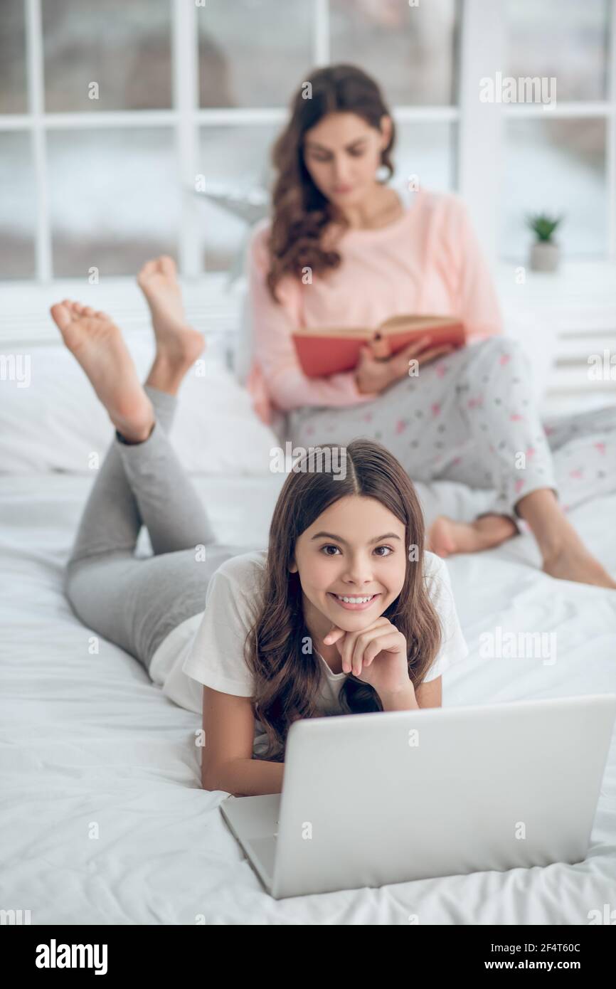 Teenager on laptop behind hi-res stock photography and images - Alamy