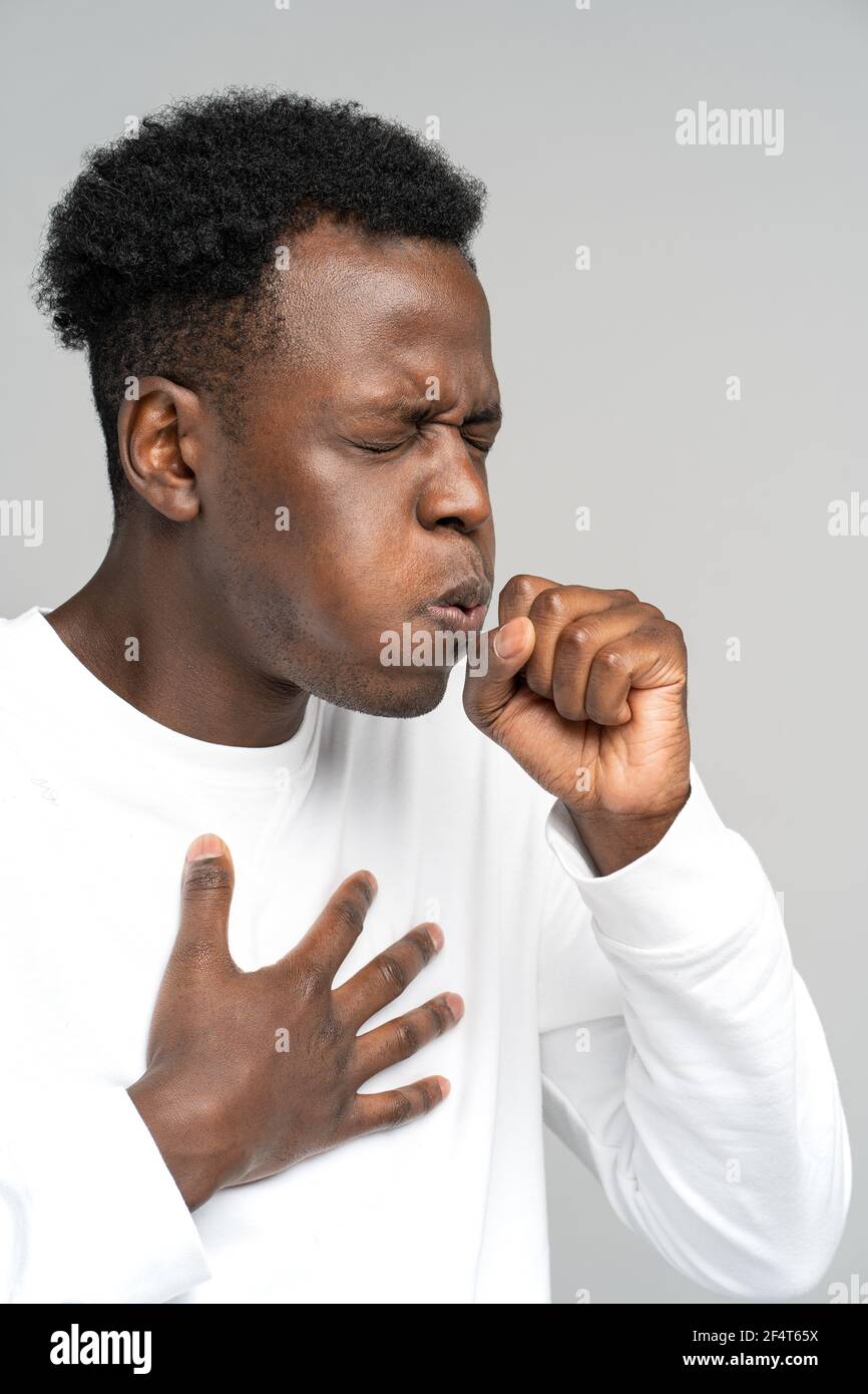 Black man coughing, suffered from asthma, flu, allergy, bronchitis