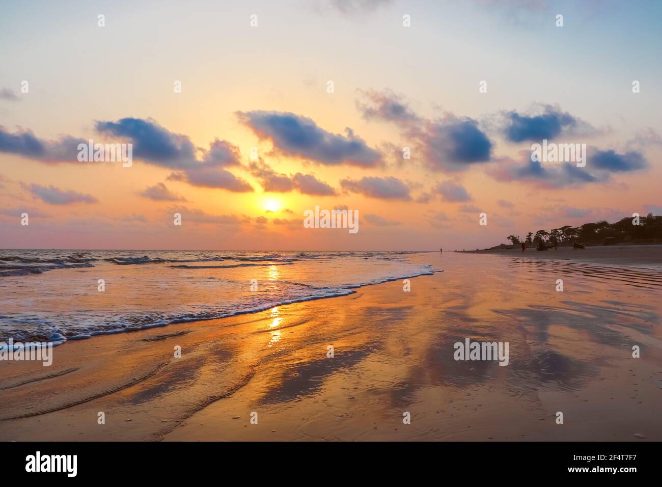 sunset landscape photo of Kuakata sea beach . evening sky reflected on wet  sand Stock Photo - Alamy, image size:1300x956