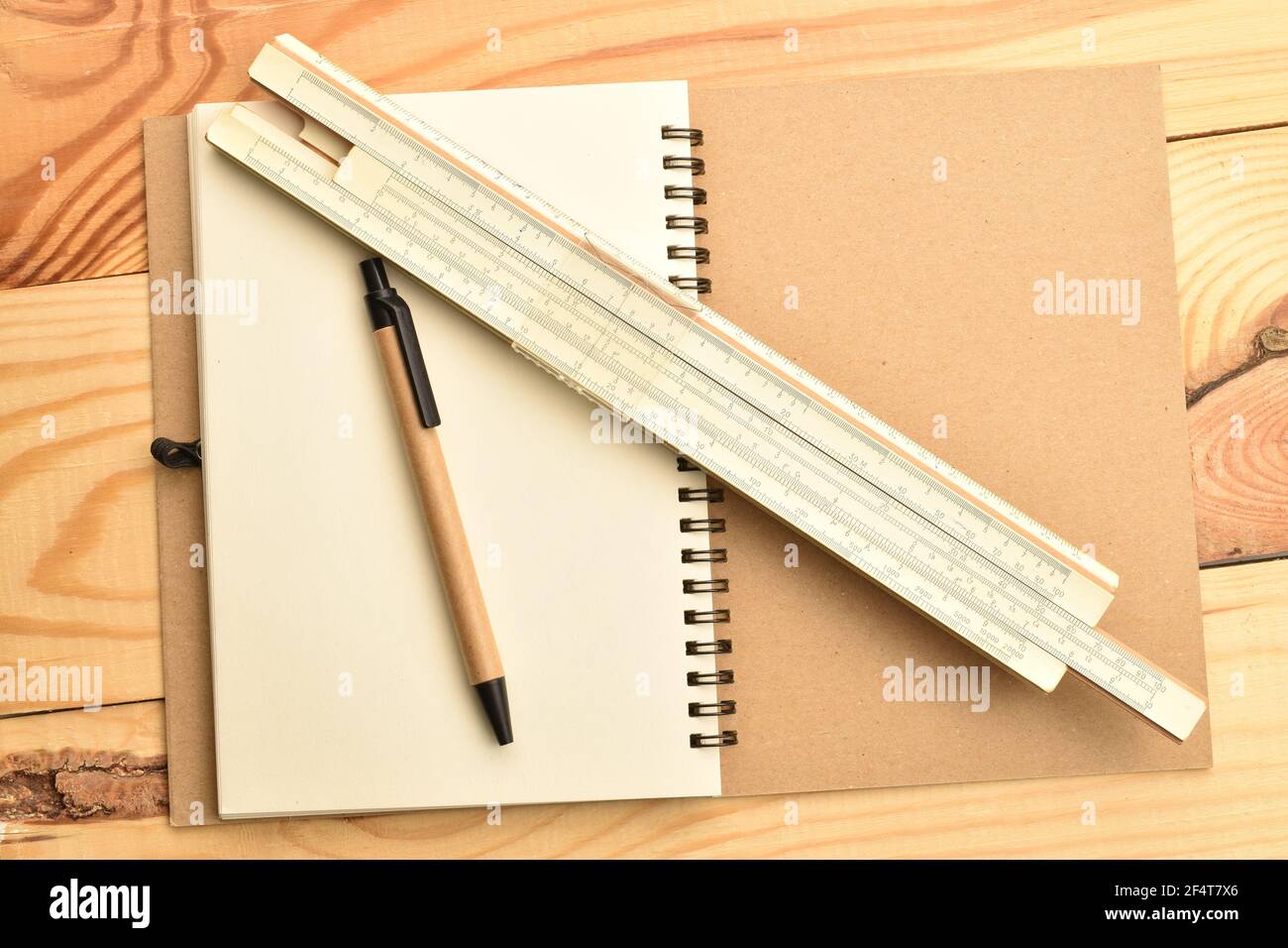 Ruler pencil notebook close up on a wooden table Stock Photo