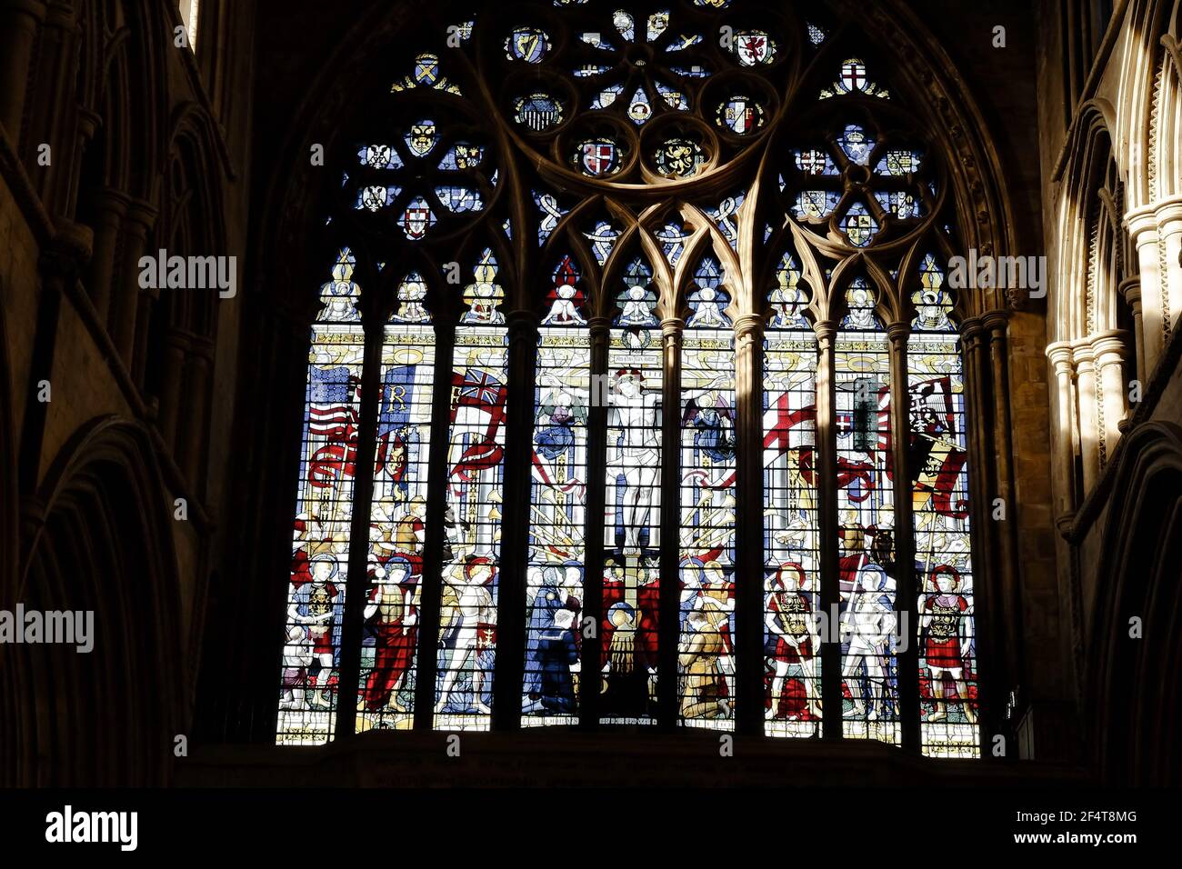 ST. ALBANS, UNITED KINGDOM - Nov 19, 2017: Stained glass window situated above the main west entrance to St. Albans Cathedral in St. Albans, UK. Stock Photo