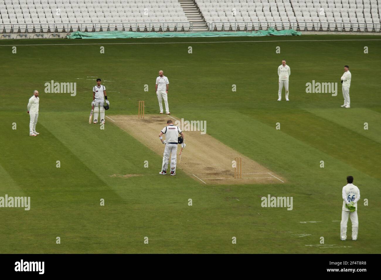 Yorkshire County Cricket, Emerald Headingley Stadium, Leeds, West Yorkshire, 23th March 2021. Pre-Season Friendly - Yorkshire County Cricket Club vs Durham County Cricket Club, Day 2. Both side pause for a moment of reflection and to show there support for all those that have lost there lives to Corona Virus (Covid 19) at 12pm today for a 1minute silence during Pre-Season Friendly - Yorkshire County Cricket Club vs Durham County Cricket Club, on Day 2. Credit: Touchlinepics/Alamy Live News Stock Photo