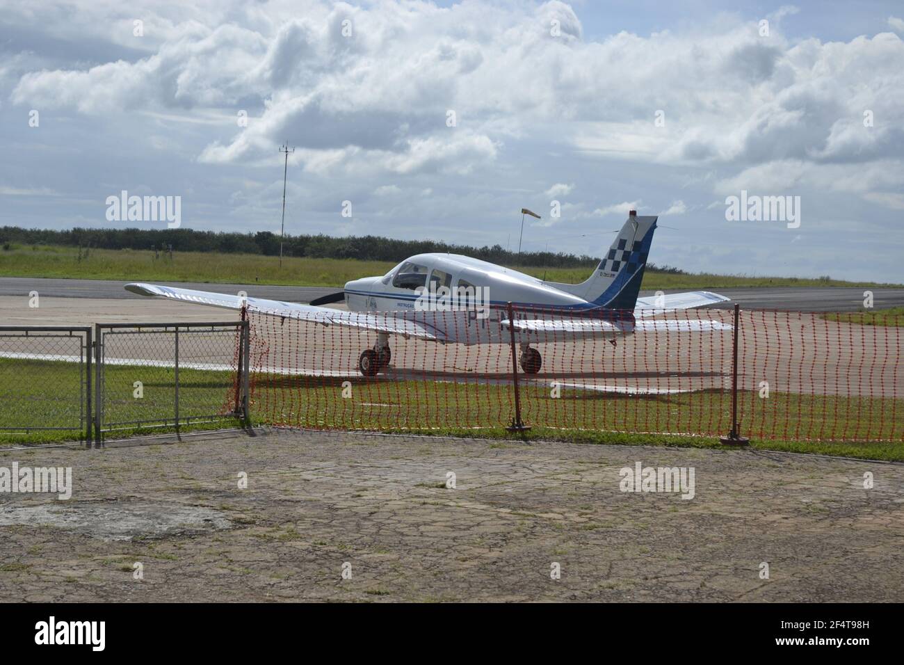 MARILIA, SAO PAULO, BRAIL, SOUTH AMERICA, MAR, 25,018. Small aircraft on the patio in blue and white colors with low wing used in instruction of pilot Stock Photo